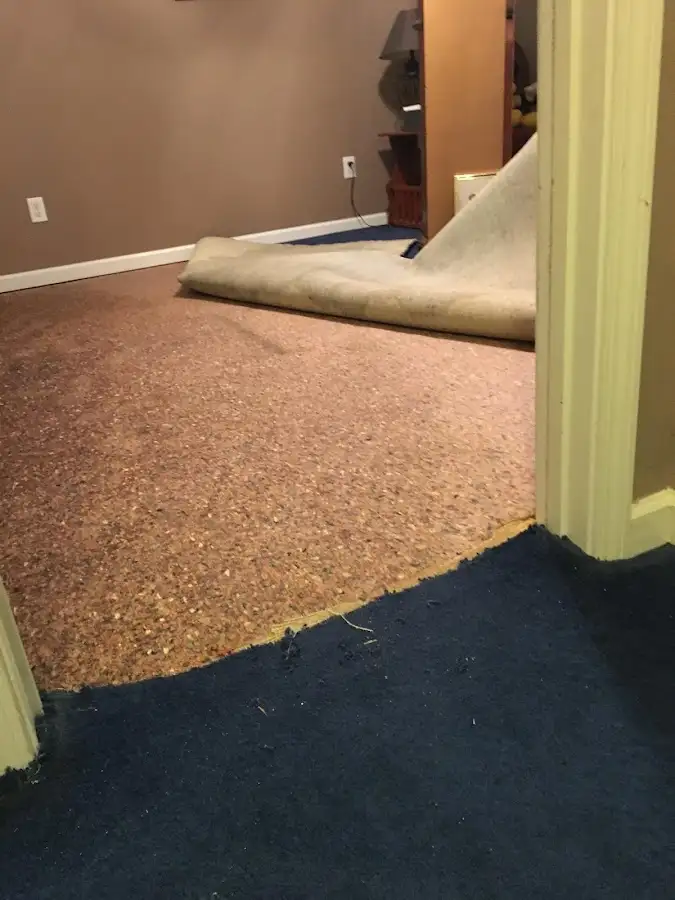Carpet pad removal revealing water damage during Drying & Dehumidification in St. Martinville